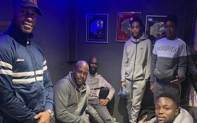 Wayne with young boys in a recording studio