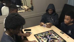 boys playing monopoly