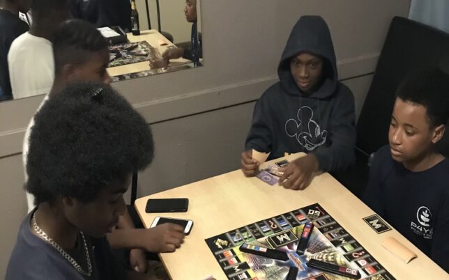 young boys playing a board game